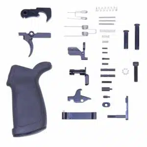 Organized AR-15 lower parts kit with pistol grip, springs, and trigger components for assembly.