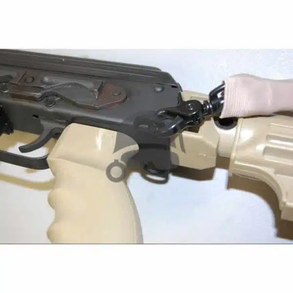 Close-up of AK-47 sling plate in tan and dark colors for tactical use.