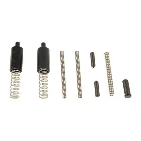 Collection of precision springs, pins, and rods for mechanical assemblies on white background.