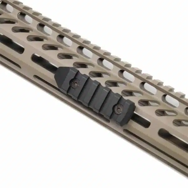 Tan handguard with Picatinny rail and black adapter for tactical accessories.