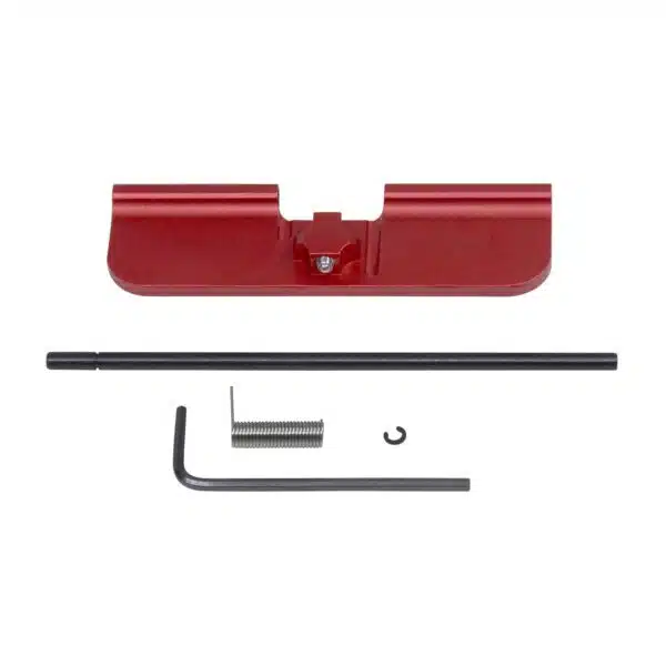 Red anodized AR-15 dust cover kit with hinge pin, spring, and hex key for customization.