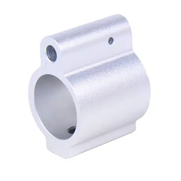 CNC machined silver metal cylinder with central bore and securing hole for mechanical assembly.
