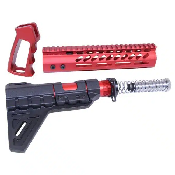 Red and black aftermarket AR-15 parts: pistol grip, handguard, and stabilizing brace.