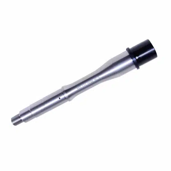 Polished stainless steel cylindrical component with black cap for precision industrial applications.
