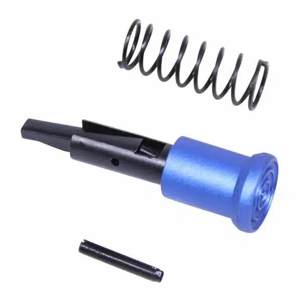 Disassembled blue anodized AR-15 forward assist with spring and parts on white background.