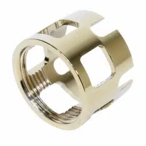 Gold-plated AR-15 castle nut with threaded interior and crown-like notched exterior.