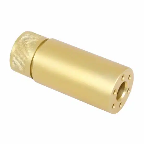 Polished brass muzzle device with knurled cap and perforations, enhancing firearm performance.