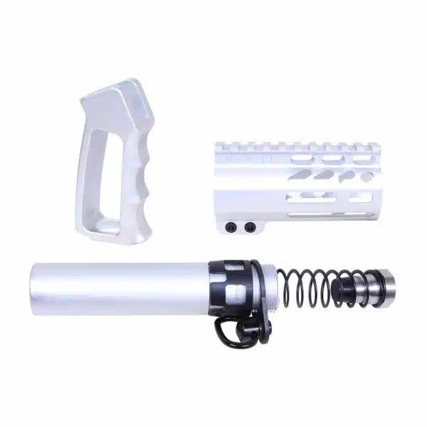 Disassembled AR-15 parts: pistol grip, handguard, buffer tube in silver aluminum.