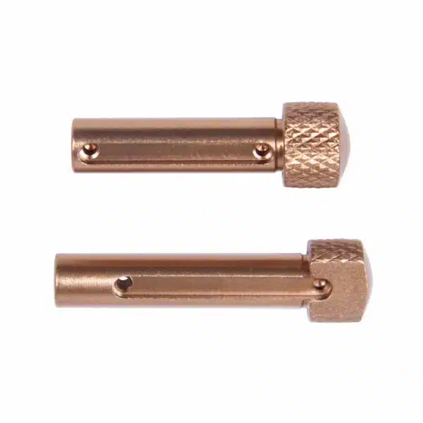 Copper-colored door hinge pins with knurled caps, smooth shafts, and security holes.