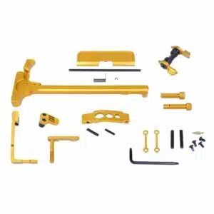 Gold anodized firearm parts kit for AR-15 customization with CNC-machined components.