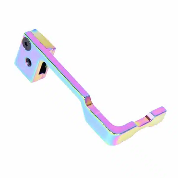 Iridescent AR-15 bolt catch release with rainbow PVD finish and geometric design.