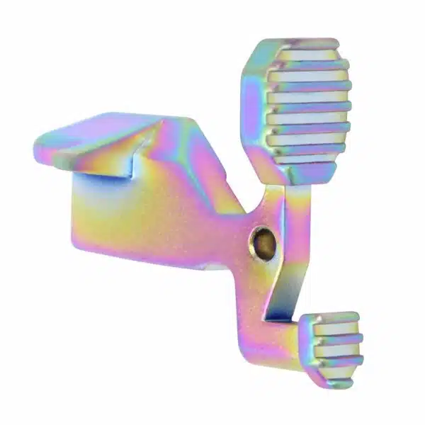 Iridescent AR-15 bolt catch, matte rainbow PVD finish, with ribbed protrusions for adjustment.