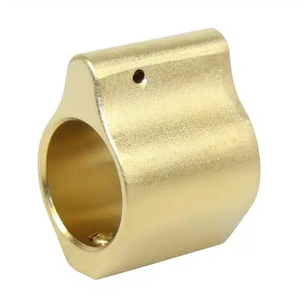 Gold-colored precision-machined cylindrical metal component with central and perpendicular bores.