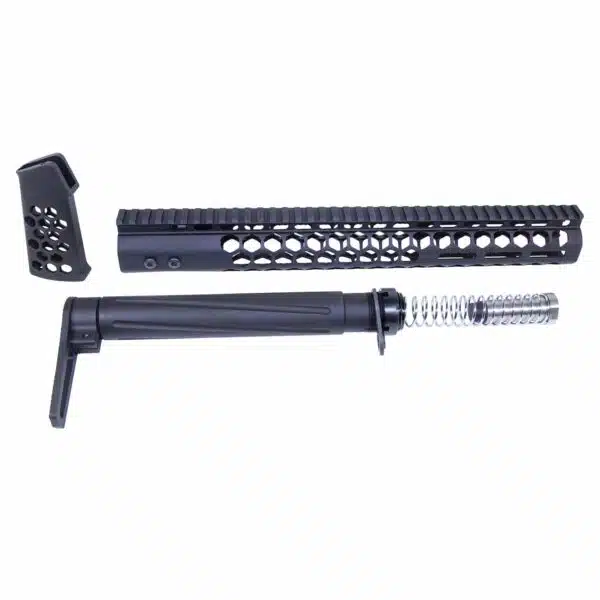 Disassembled black AR-style rifle components, including handguard, barrel assembly, and ergonomic grip.