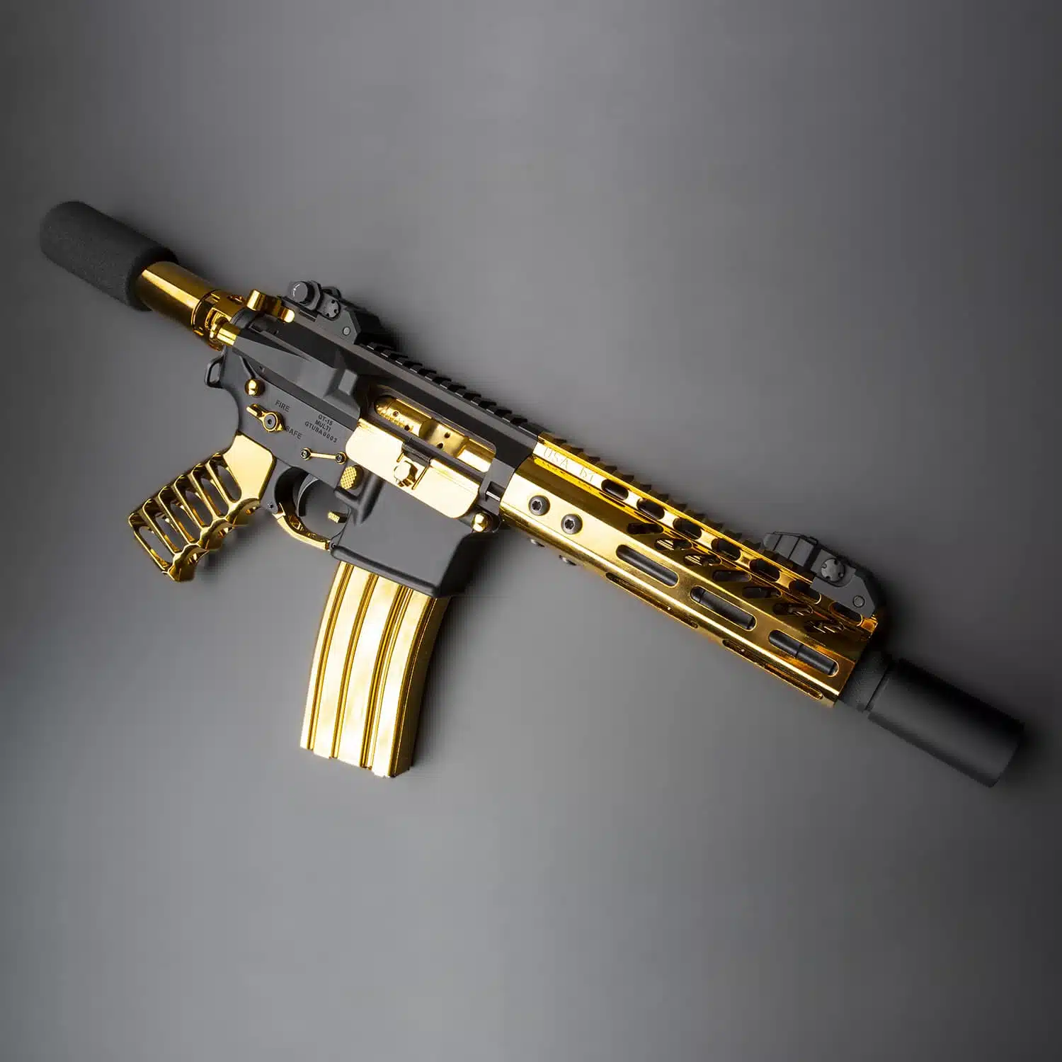 Gold plated 7 inch M-LOK free floating handguard with monolithic top rail mounted on an AR-15 upper receiver.
