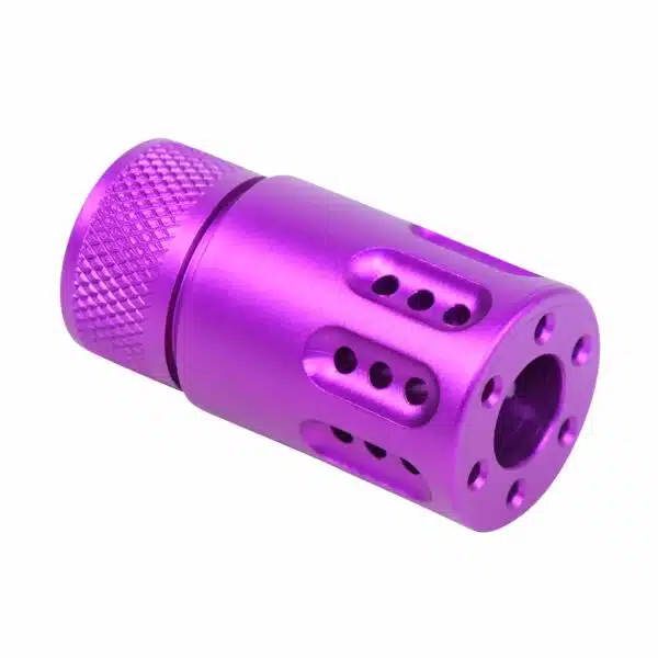Precision-machined purple firearm muzzle device with knurled grip and ventilation holes.