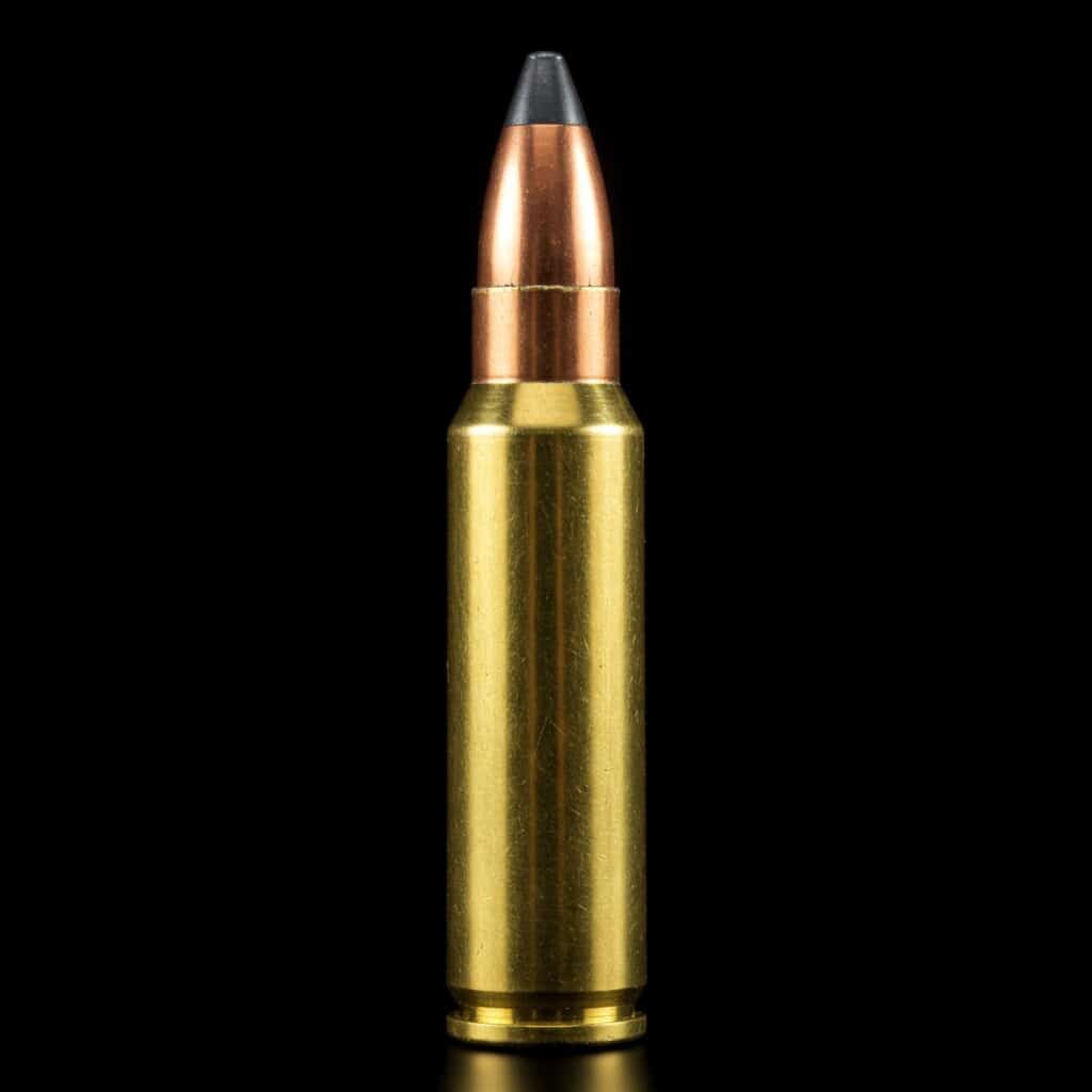Rifle cartridge with brass casing and copper bullet, featuring a polymer tip for performance.