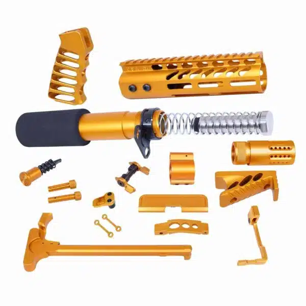 Gold anodized AR-15 upgrade kit with handguard, grip, buffer tube, trigger, and pins.