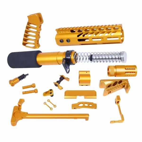 Gold-colored AR-15 parts kit including handgrip, barrel shroud, and precision components on white background.