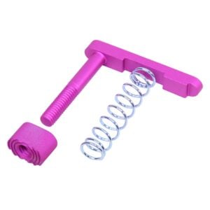 Anodized pink AR-15 mag catch assembly with extended mag button on white background.