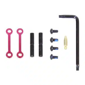 AR-15 anti-rotation trigger and hammer pin set in anodized rose finish with black pins, screws, and Allen key