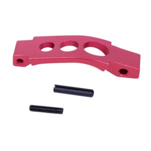 Red anodized AR-15 trigger guard with pin and screw, showcasing sleek design and precision machining.