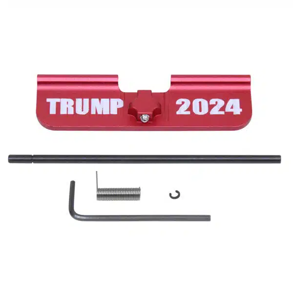 AR-15 dust cover with TRUMP 2024 engraving in anodized red.