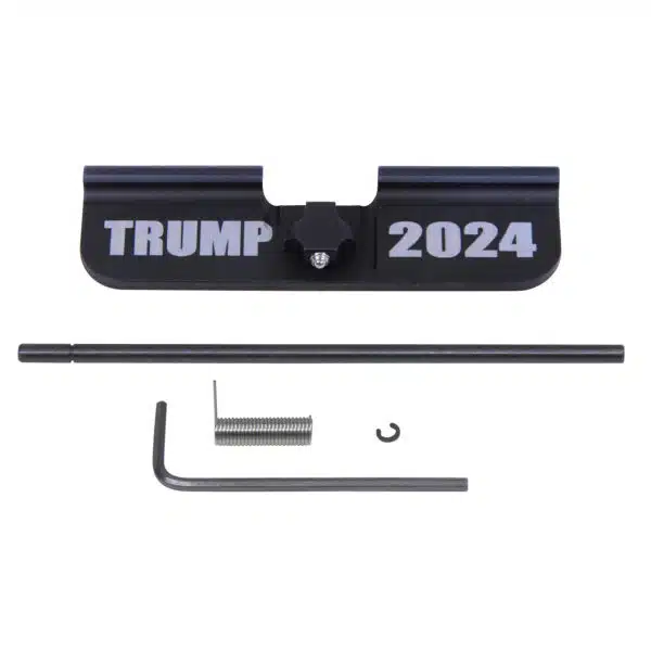 AR-15 dust cover with TRUMP 2024 engraving and assembly tools.