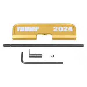 AR-15 dust cover with TRUMP 2024 engraving in anodized gold.