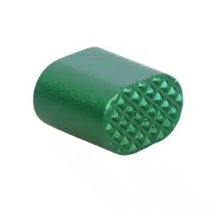Green AR-15 extended mag release button with textured grip surface.
