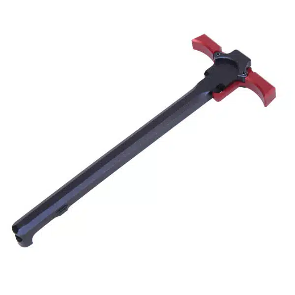 Ambidextrous AR-15 charging handle with black body and red latch extensions for enhanced grip.