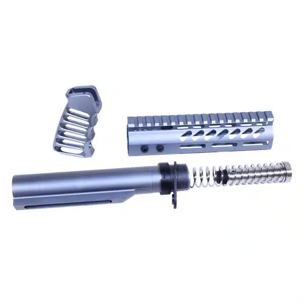 Disassembled AR-15 components: buffer spring, handguard, buffer tube in anodized grey.
