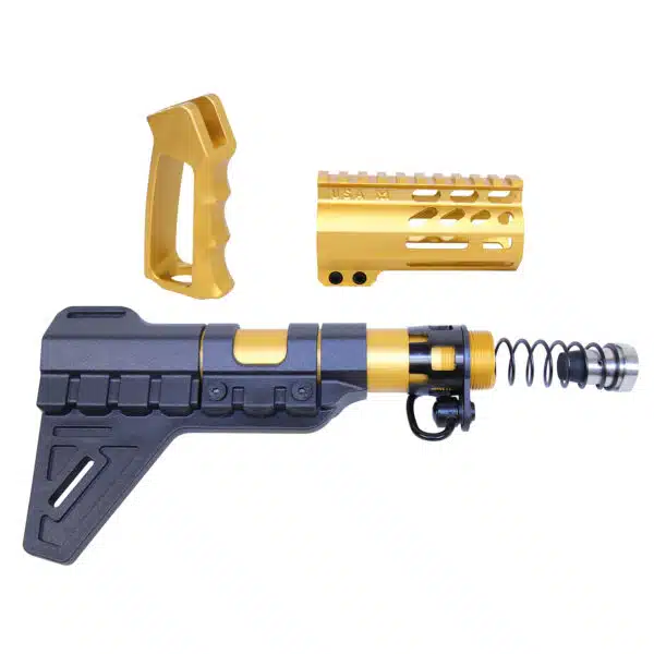 Gold and black AR-15 customization kit with pistol brace, ergonomic grip, and barrel shroud.
