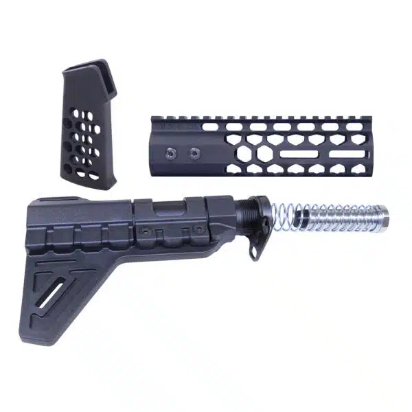 Disassembled AR-15 parts: ergonomic grip, stabilizing brace, and honeycomb handguard for customization.