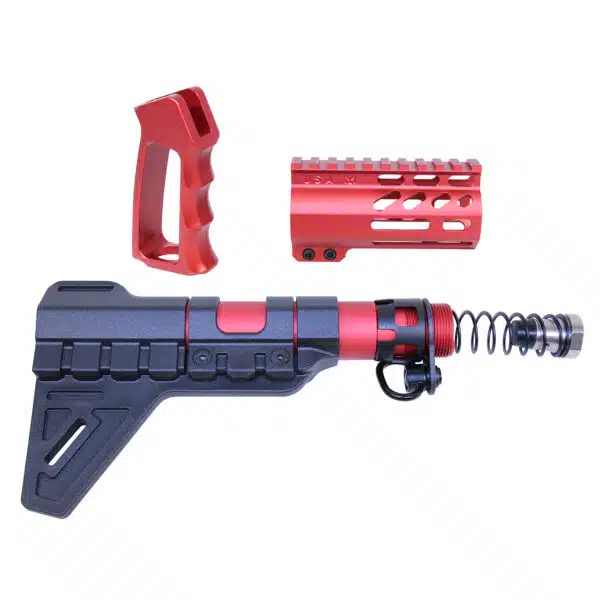 Red and black AR-15 pistol parts for customization and performance on white background.