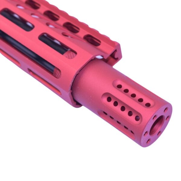 Custom red firearm barrel and handguard with precision-cut cooling vents and muzzle brake.