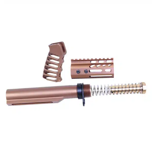 Rose gold AR-15 kit with barrel, ergonomic grip, rail, and spring assembly.