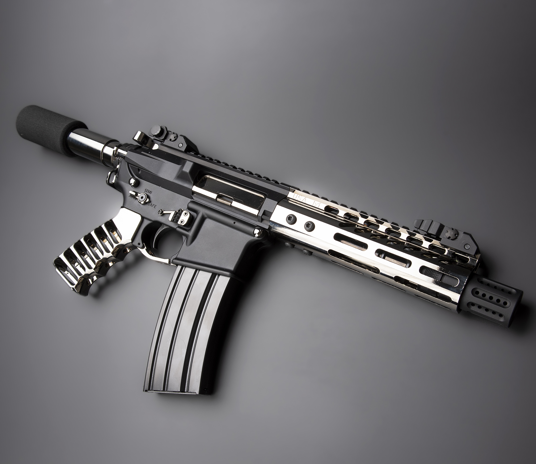 AR-15 pistol with Black Chrome finish and skeletonized grip